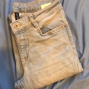 Ripped skinny jeans with shredded pant cuffs